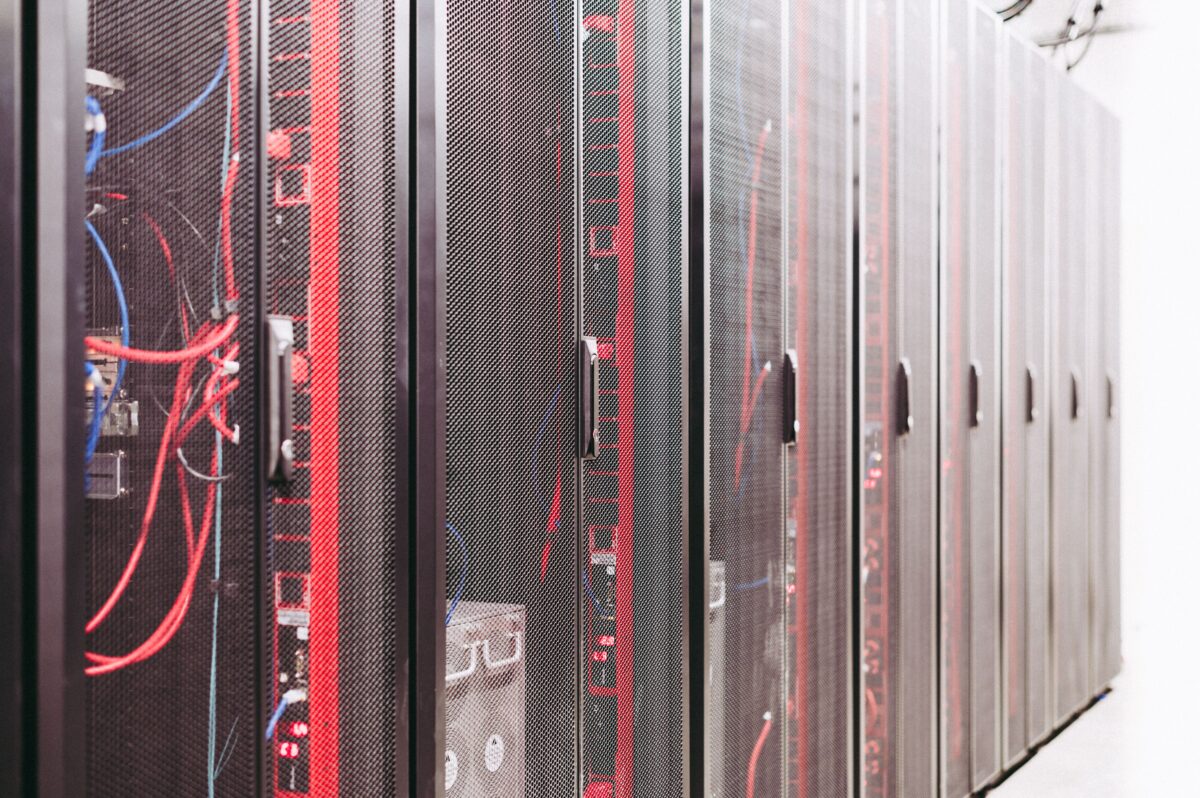 For years, a data center was a fairly predictable building: rows of air-cooled servers, a steady power feed, and a network built around web traffic. AI has broken that template. Training and running large models packs enormous amounts of power into small spaces, and the buildings built for the cloud era are struggling to keep up. For ongoing coverage of the hardware driving this shift, see our AI infrastructure and semiconductor news.
